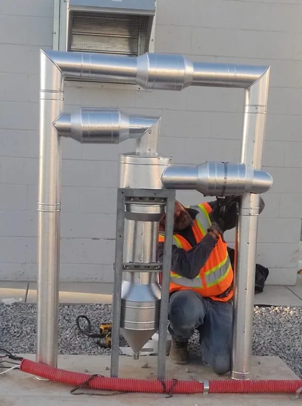 Industrial worker inspecting pipes